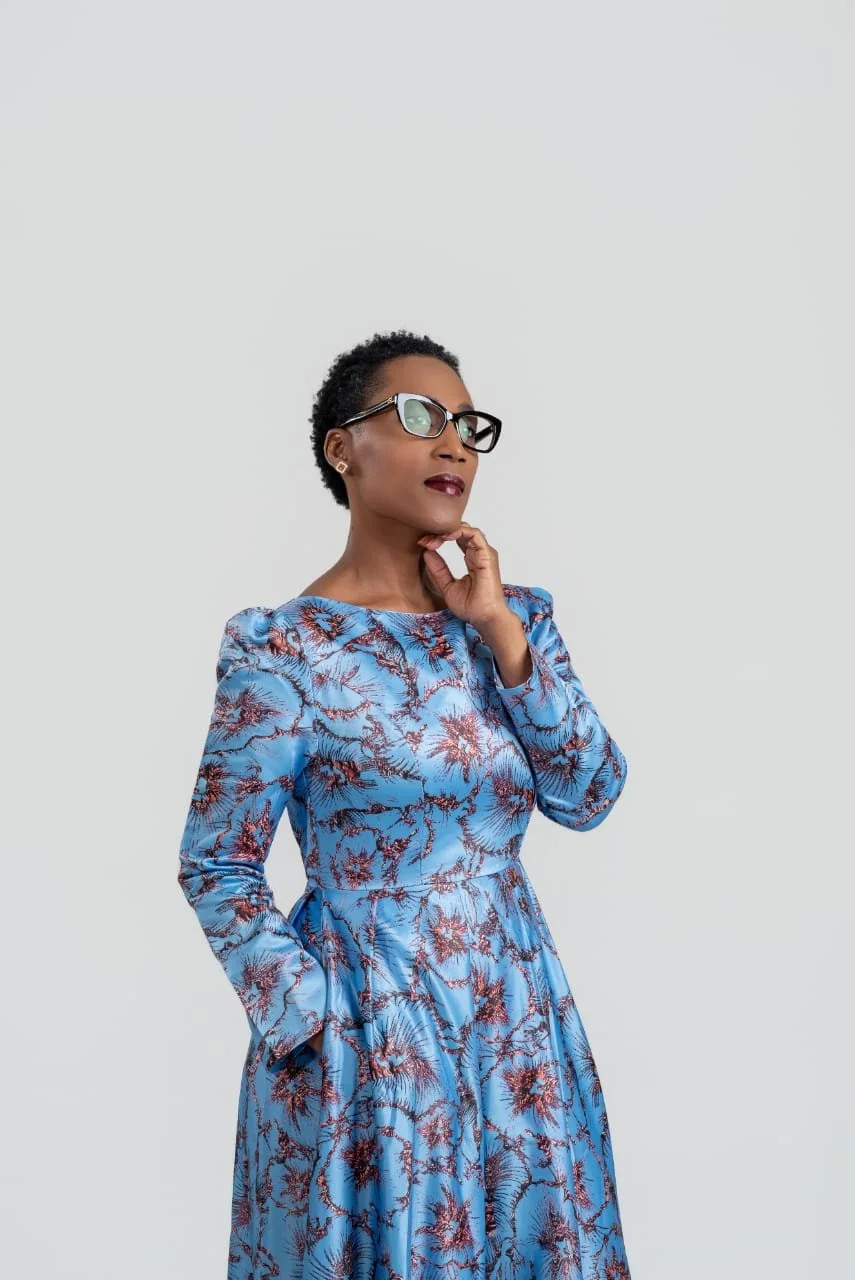 Rolanda Desir Andre wearing a blue floral dress